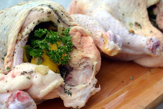 Uncooked chicken stuffed with herbs