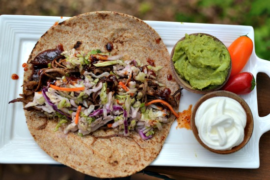 Pulled pork taco with sour cream and guac