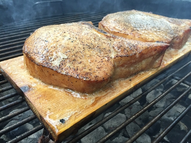 Pork Chops Cooking on a Cedar Plank