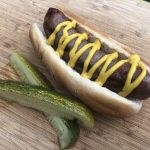 Beer Brat with Mustard and Kosher Pickle