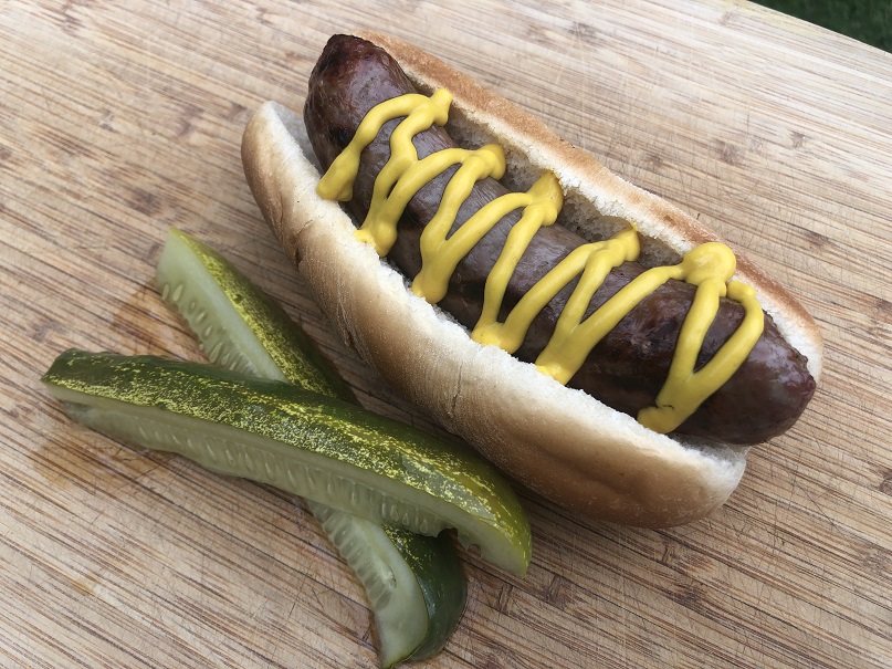 Beer Brat with Mustard and Kosher Pickle