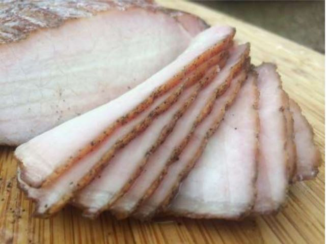 Sliced pork chop smoked on a Weber
