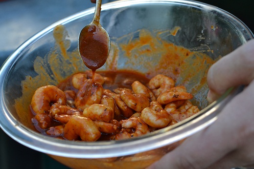 Tossing the shrimp in Cajun sauce