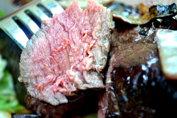 Slice of Cooked Marinated New York Strip Steak 