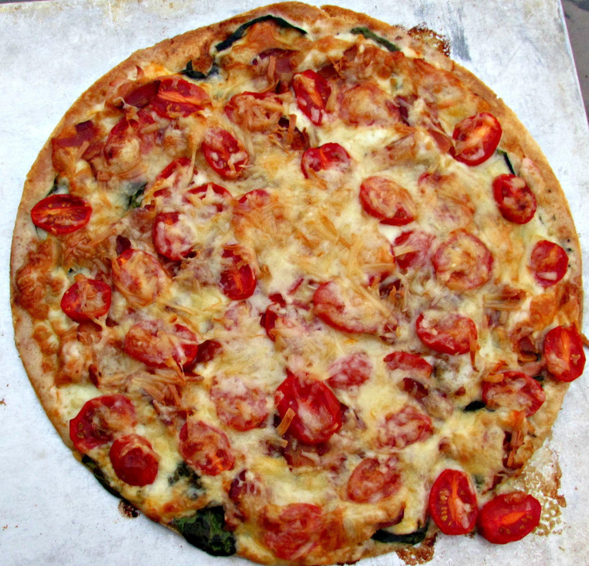 Fresh tomatoes on a pizza